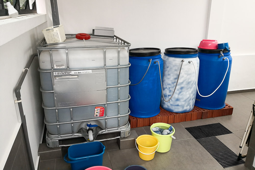 These tanks can collect up to 1600 litres of rainwater which is used to clean the car porch and water the plants. (Photo by Wong Twee Hee) 